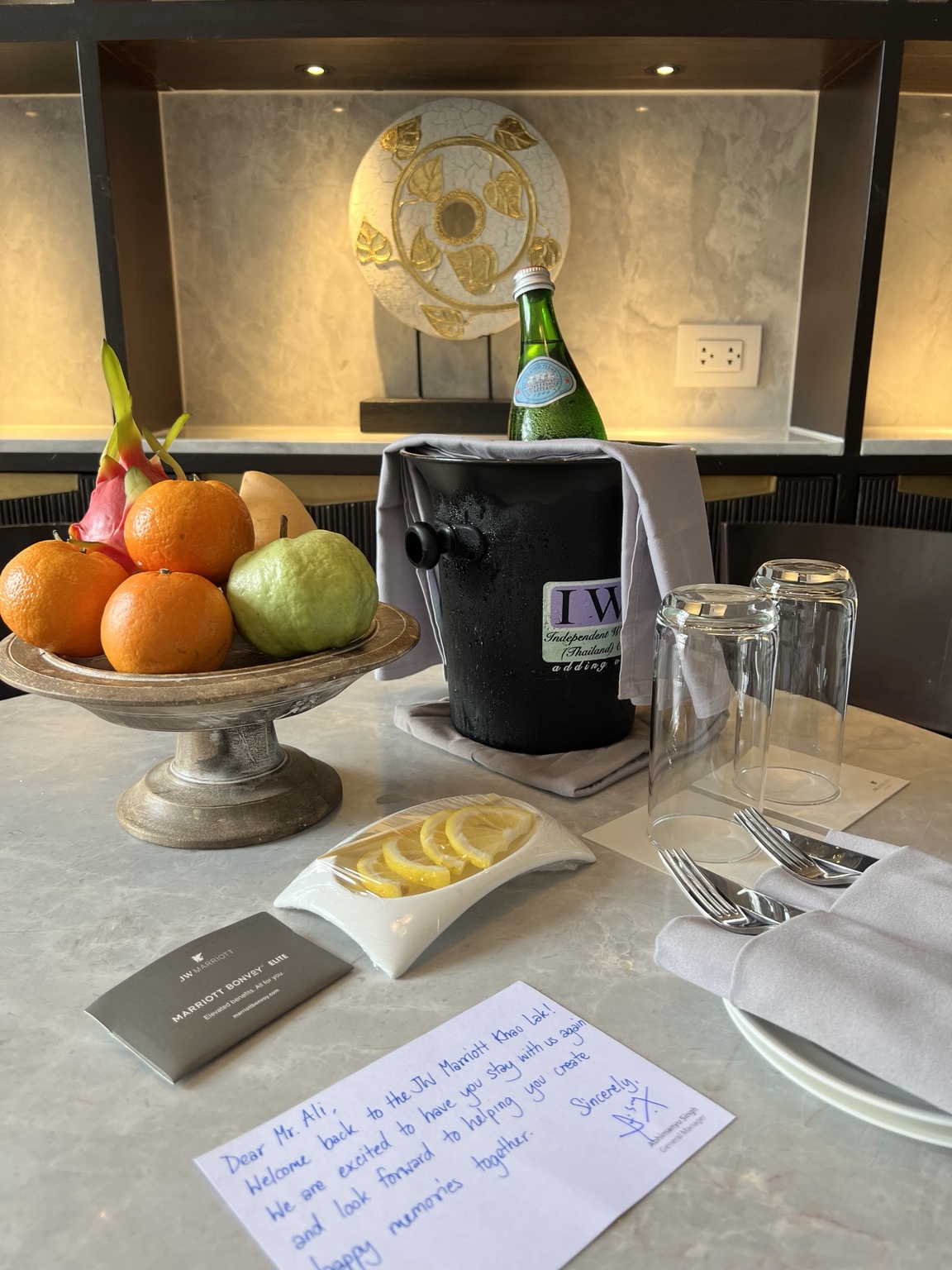 Fruit, bottled water and a welcome note at JW Marriott Khao Lak
