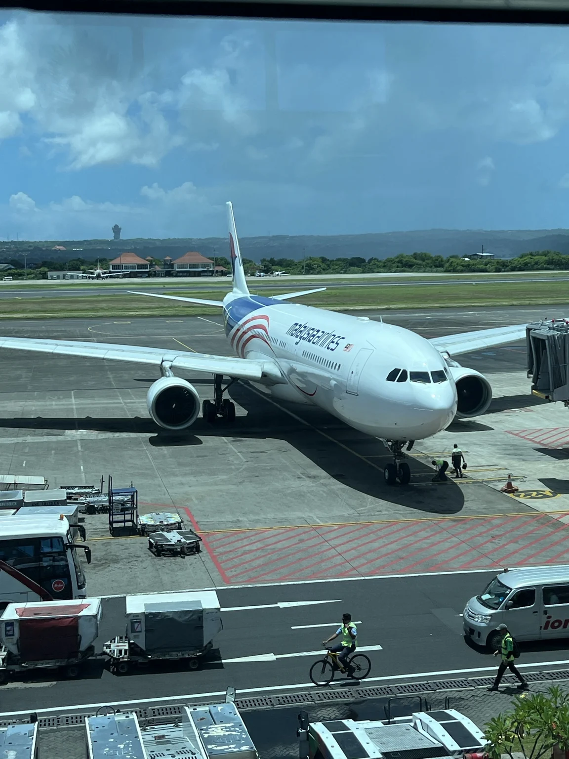 Malaysia Airlines aircraft at the gate before departure.